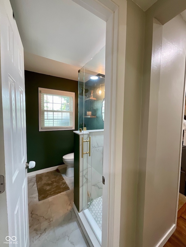 3520 Lantern Ln, Columbus, IN 47203 - full bathroom with toilet, a marble finish shower, and marble look tile flooring