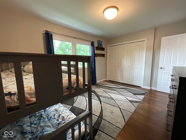 3520 Lantern Ln, Columbus, IN 47203 - bedroom with a closet, wood finished floors, and baseboards
