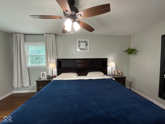 3520 Lantern Ln, Columbus, IN 47203 - bedroom with baseboards, a ceiling fan, and wood finished floors