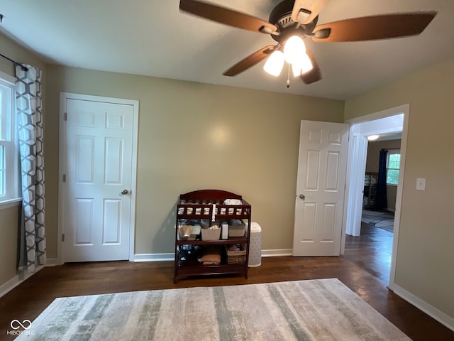3520 Lantern Ln, Columbus, IN 47203 - bedroom with wood finished floors, baseboards, and a ceiling fan