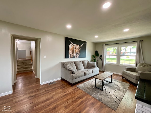 3520 Lantern Ln, Columbus, IN 47203 - living room with dark wood finished floors, recessed lighting, stairway, and baseboards