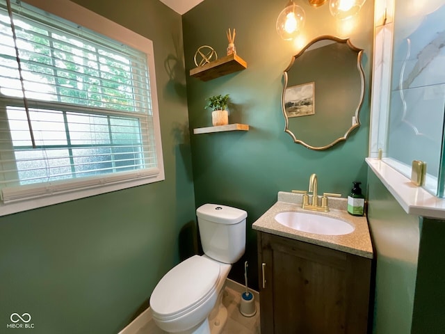 3520 Lantern Ln, Columbus, IN 47203 - half bath with vanity, toilet, and baseboards
