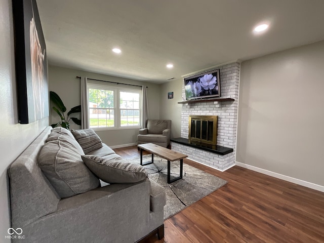 3520 Lantern Ln, Columbus, IN 47203 - living room featuring wood finished floors, baseboards, recessed lighting, and a fireplace
