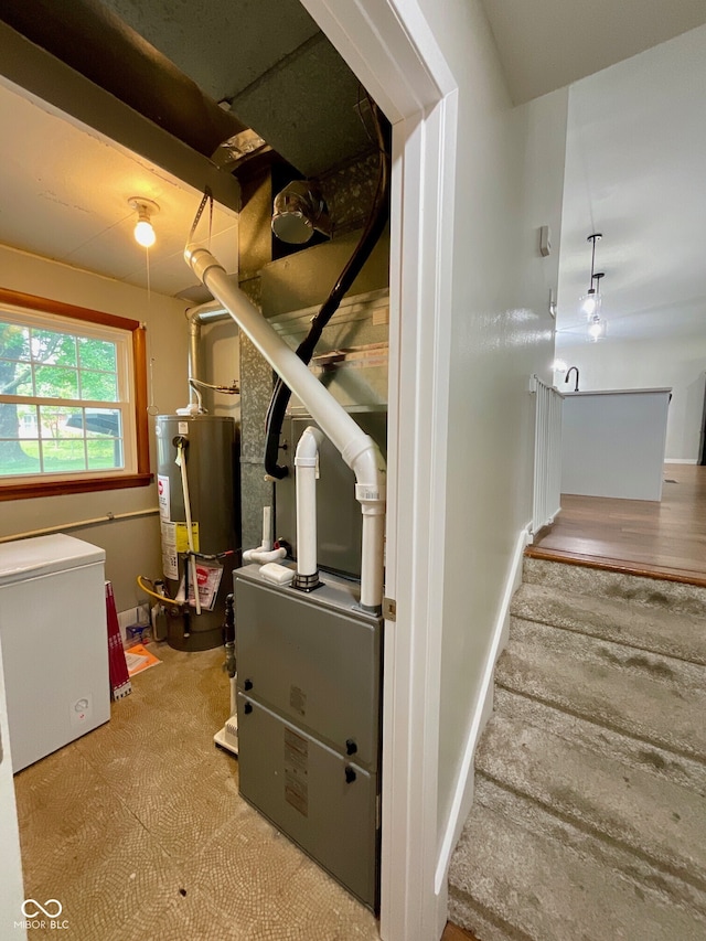 3520 Lantern Ln, Columbus, IN 47203 - staircase featuring water heater and heating unit