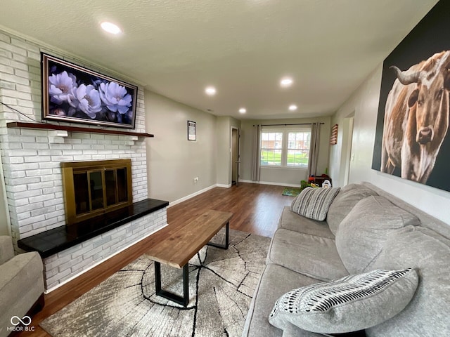 3520 Lantern Ln, Columbus, IN 47203 - living area with wood finished floors, recessed lighting, a fireplace, and baseboards