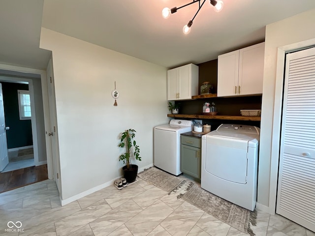 3520 Lantern Ln, Columbus, IN 47203 - washroom with cabinet space, light marble finish floors, independent washer and dryer, and baseboards