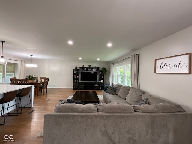 3520 Lantern Ln, Columbus, IN 47203 - living room featuring wood finished floors, recessed lighting, baseboards, and a chandelier