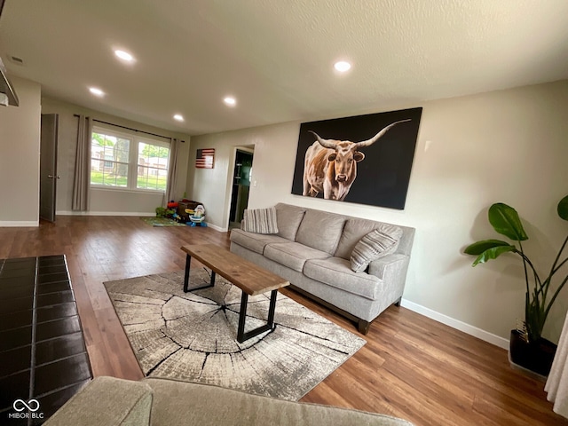 3520 Lantern Ln, Columbus, IN 47203 - living area with wood finished floors, baseboards, and recessed lighting
