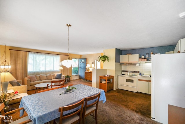 623 Circle Ct, Whiteland, IN 46184 - dining area with dark carpet and a chandelier