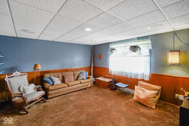 623 Circle Ct, Whiteland, IN 46184 - carpeted living room featuring wallpapered walls, wainscoting, a paneled ceiling, and wooden walls