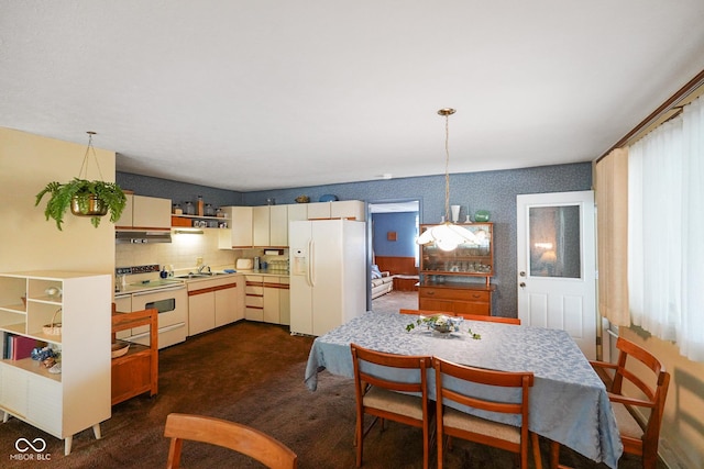 623 Circle Ct, Whiteland, IN 46184 - dining area with healthy amount of natural light and dark colored carpet