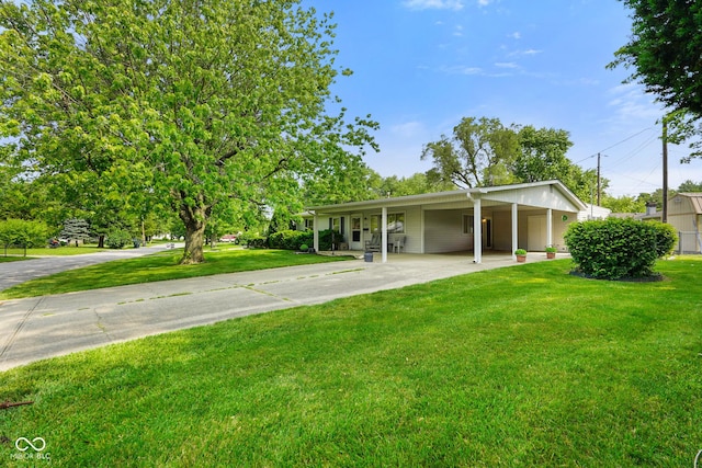 623 Circle Ct, Whiteland, IN 46184 - view of green lawn with concrete driveway and an attached carport