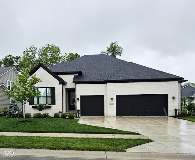 5686 Ellie Ct, Noblesville, IN 46062 - view of front of property featuring an attached garage, brick siding, and a front yard
