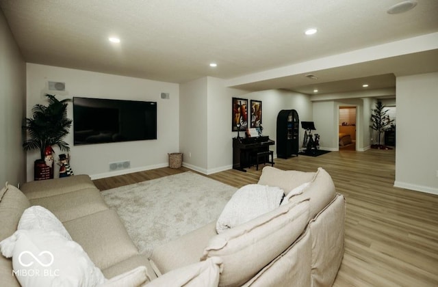 5686 Ellie Ct, Noblesville, IN 46062 - living area featuring baseboards, light wood-type flooring, and recessed lighting
