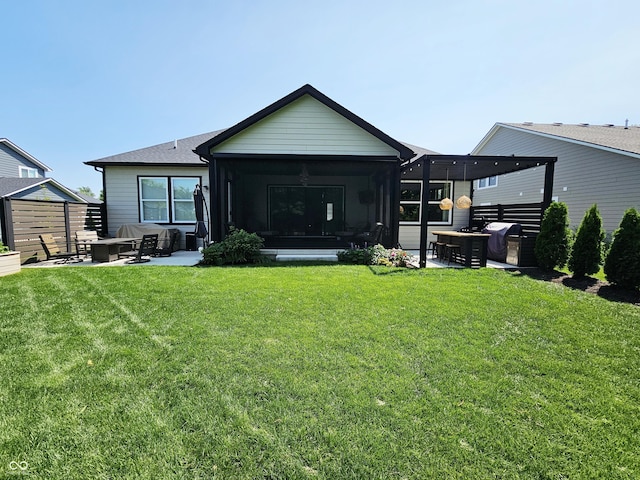 5686 Ellie Ct, Noblesville, IN 46062 - rear view of house featuring a sunroom, a patio, and a fire pit