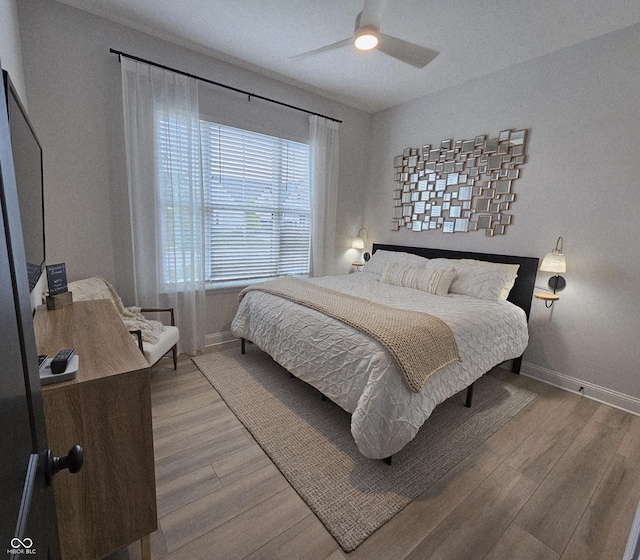 5686 Ellie Ct, Noblesville, IN 46062 - bedroom with baseboards, wood finished floors, and ceiling fan