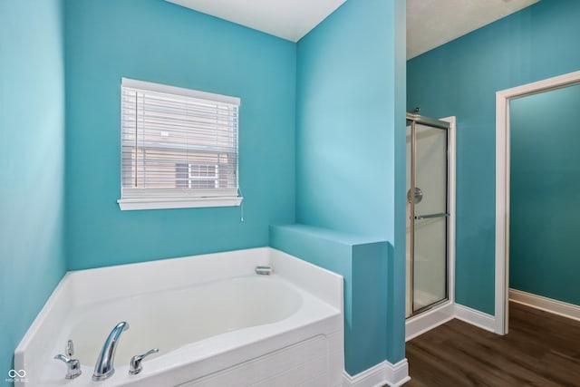 1893 Devonshire Ave, Avon, IN 46123 - bathroom with a shower stall, a bath, and wood finished floors