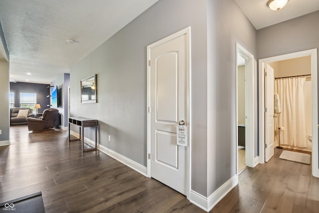 1893 Devonshire Ave, Avon, IN 46123 - hallway with dark wood-style floors, baseboards, and a textured ceiling