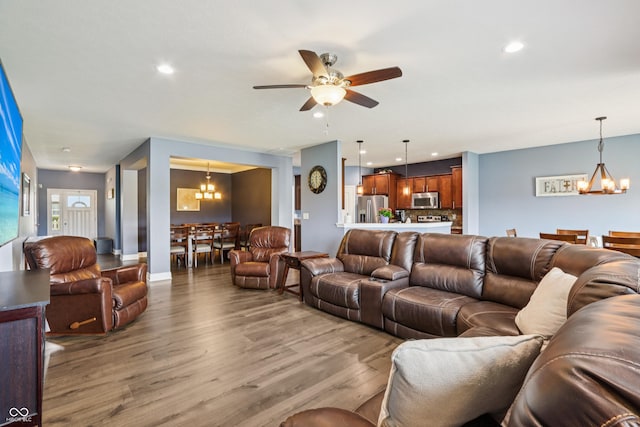 1893 Devonshire Ave, Avon, IN 46123 - living room featuring a chandelier, wood finished floors, a ceiling fan, and recessed lighting