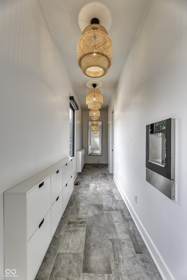8695 Morgan Dr, Fishers, IN 46038 - hall featuring stone finish floors and baseboards