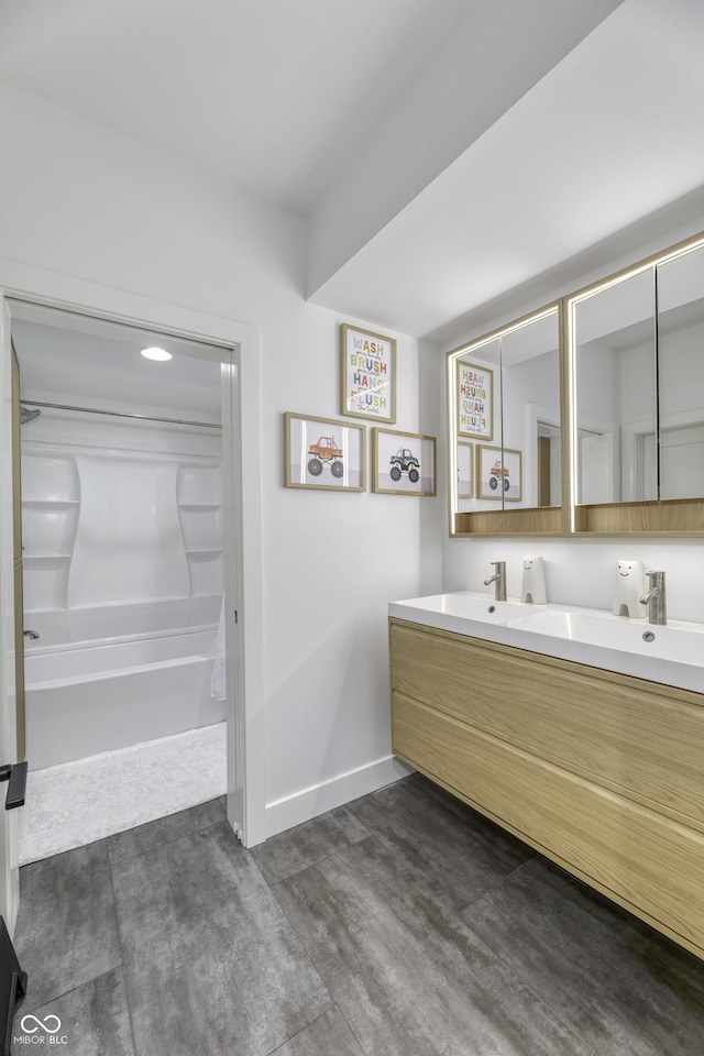 8695 Morgan Dr, Fishers, IN 46038 - bathroom with double vanity, wood finished floors, and shower / bathtub combination