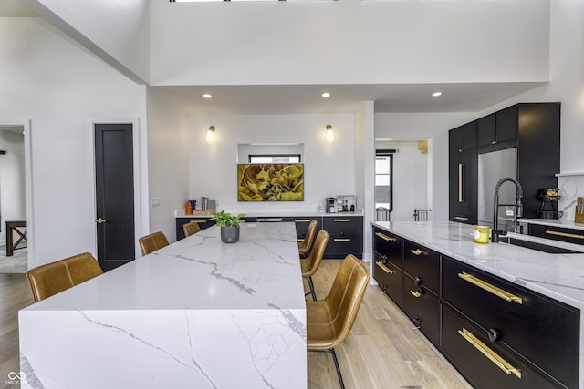 8695 Morgan Dr, Fishers, IN 46038 - dining area with light wood-type flooring, recessed lighting, and a towering ceiling