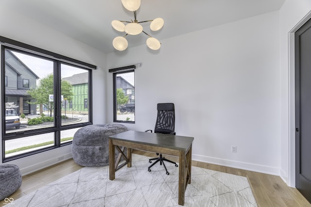 8695 Morgan Dr, Fishers, IN 46038 - office area with wood finished floors and a chandelier