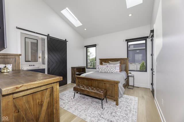 8695 Morgan Dr, Fishers, IN 46038 - bedroom with a skylight, high vaulted ceiling, a barn door, light wood-style flooring, and recessed lighting