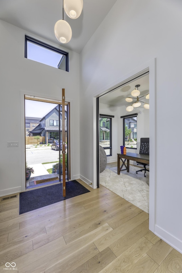 8695 Morgan Dr, Fishers, IN 46038 - entryway featuring light wood-style floors and a high ceiling