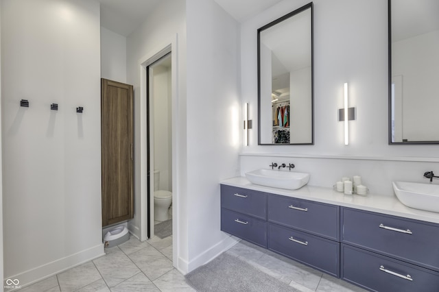 8695 Morgan Dr, Fishers, IN 46038 - bathroom featuring double vanity and a walk in closet