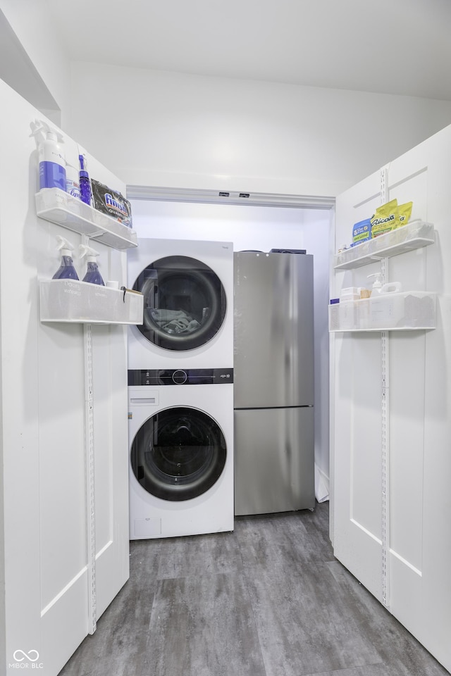 8695 Morgan Dr, Fishers, IN 46038 - laundry room with stacked washer / drying machine and wood finished floors
