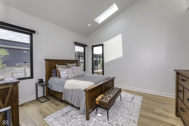 8695 Morgan Dr, Fishers, IN 46038 - bedroom featuring a skylight, light wood finished floors, and high vaulted ceiling
