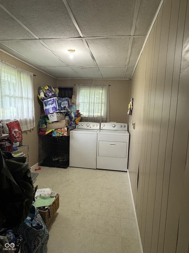 800 N Walnut Hls, Crawfordsville, IN 47933 - laundry area featuring washer and dryer, healthy amount of natural light, wooden walls, baseboards, and tile patterned floors