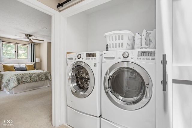 8133 Lower Bay Ln, Indianapolis, IN 46236 - laundry area with washing machine and clothes dryer, carpet, ceiling fan, and a textured ceiling