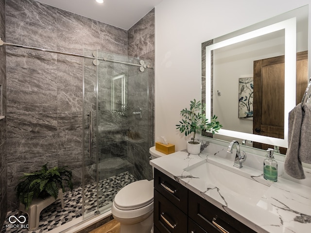 2004 Layton Rd, Anderson, IN 46011 - bathroom featuring vanity, a stall shower, toilet, and recessed lighting