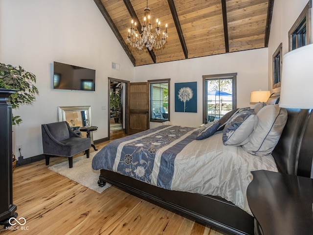 2004 Layton Rd, Anderson, IN 46011 - bedroom with wood ceiling with exposed beams, high vaulted ceiling, a chandelier, hardwood / wood-style flooring, and baseboards