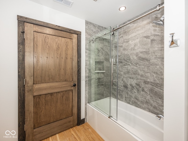 2004 Layton Rd, Anderson, IN 46011 - bathroom with bath / shower combo with glass door, wood finished floors, and recessed lighting