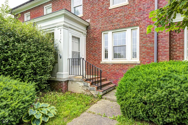 8436 E 56th St, Indianapolis, IN 46216 - doorway to property featuring brick siding