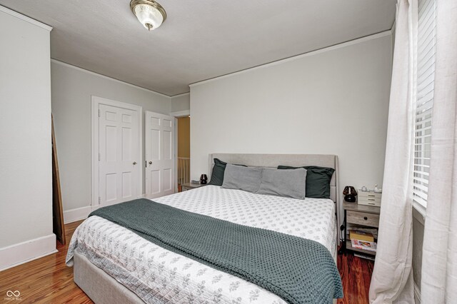 8436 E 56th St, Indianapolis, IN 46216 - bedroom featuring crown molding and wood finished floors