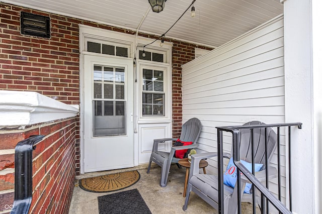 8436 E 56th St, Indianapolis, IN 46216 - doorway to property featuring brick siding