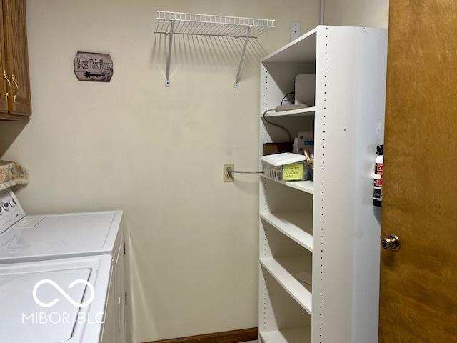 9451 S Amanda Dr, Claypool, IN 46510 - laundry room with independent washer and dryer and cabinet space