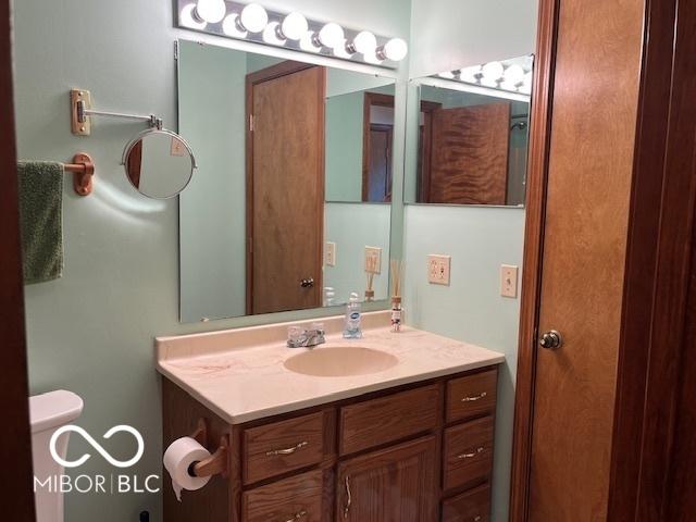 9451 S Amanda Dr, Claypool, IN 46510 - bathroom featuring vanity and toilet