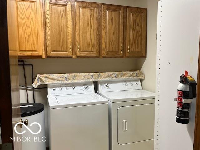 9451 S Amanda Dr, Claypool, IN 46510 - washroom with washer and clothes dryer and cabinet space