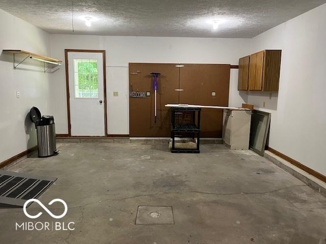 9451 S Amanda Dr, Claypool, IN 46510 - garage with baseboards