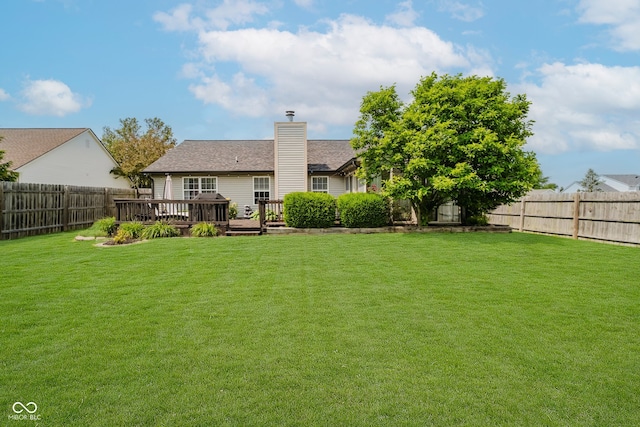 293 E Quail Wood Ln, Westfield, IN 46074 - rear view of house featuring a fenced backyard, a chimney, and a wooden deck