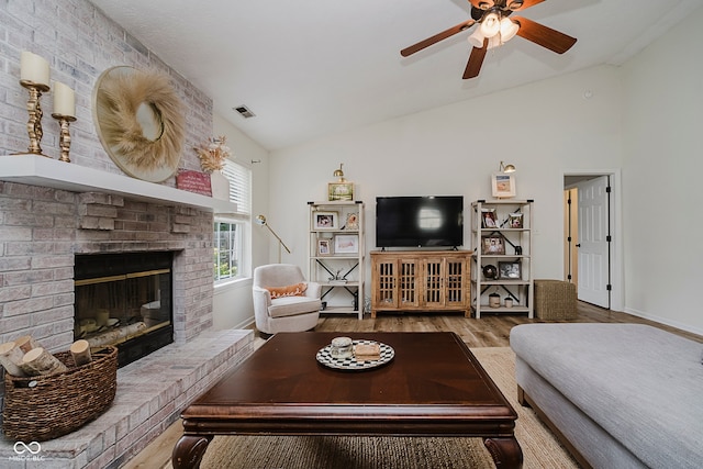 293 E Quail Wood Ln, Westfield, IN 46074 - living area featuring lofted ceiling, ceiling fan, wood finished floors, and a fireplace
