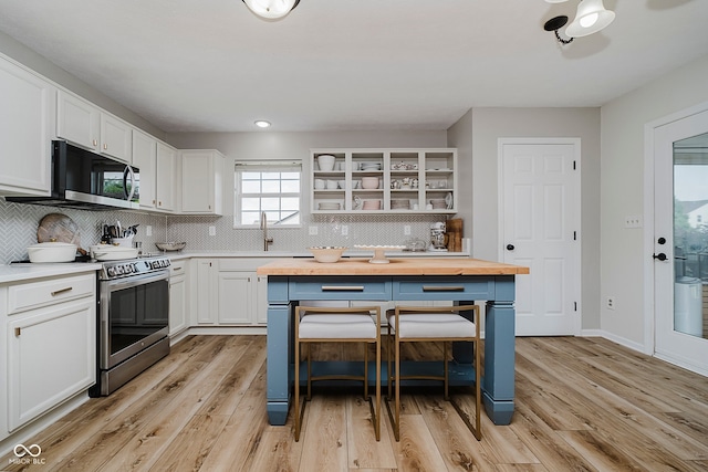 293 E Quail Wood Ln, Westfield, IN 46074 - kitchen with stainless steel appliances, butcher block counters, white cabinets, tasteful backsplash, and recessed lighting