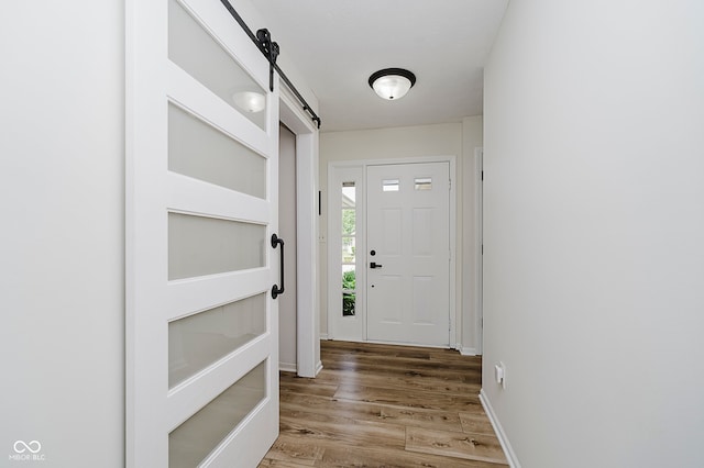 293 E Quail Wood Ln, Westfield, IN 46074 - doorway featuring light wood-style flooring and a barn door