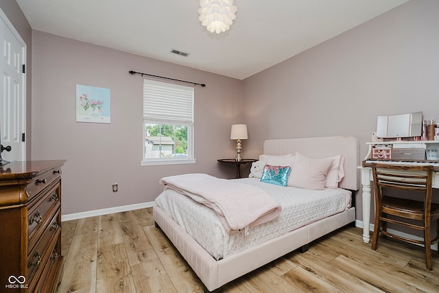 293 E Quail Wood Ln, Westfield, IN 46074 - bedroom with light wood-style flooring and baseboards