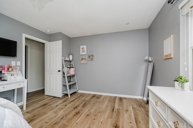 293 E Quail Wood Ln, Westfield, IN 46074 - bedroom featuring light wood-style flooring and baseboards